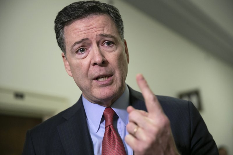 FILE - In this Dec. 17, 2018, file photo, former FBI Director James Comey speaks to reporters on Capitol Hill Washington. The Justice Department’s inspector general says former FBI Director James Comey violated FBI policies in his handling of memos documenting private conversations with President Donald Trump. (AP Photo/J. Scott Applewhite, File)
story.lead_photo.caption
