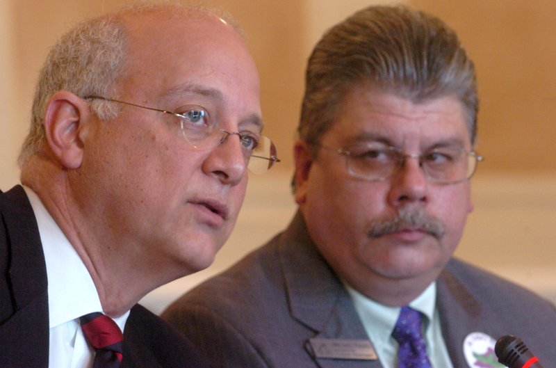 FILE — State Rep. Ed Garner (left) and Chief Economist and state Economic Forecaster Michael Pakko present a bill to the Senate Committee on Revenue and Taxation in this March 16, 2011 file photo.
