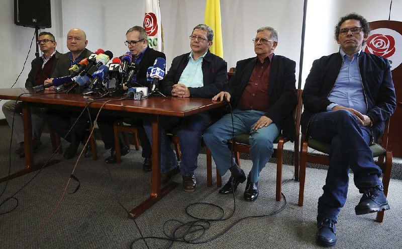 The former commanders of the Revolutionary Armed Forces of Colombia and now its legal political party leaders attend a news conference Thursday in Bogota.