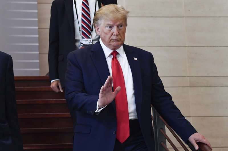 U.S President Donald Trump arrives to attend a lunch on &quot;digital transformation&quot;, during the G7 summit in Biarritz, southwestern France, Monday Aug.26 2019. G-7 leaders are wrapping up a summit dominated by tensions over U.S. trade policies and a surprise visit by Iran's top diplomat. (Nicholas Kamm /POOL via AP)