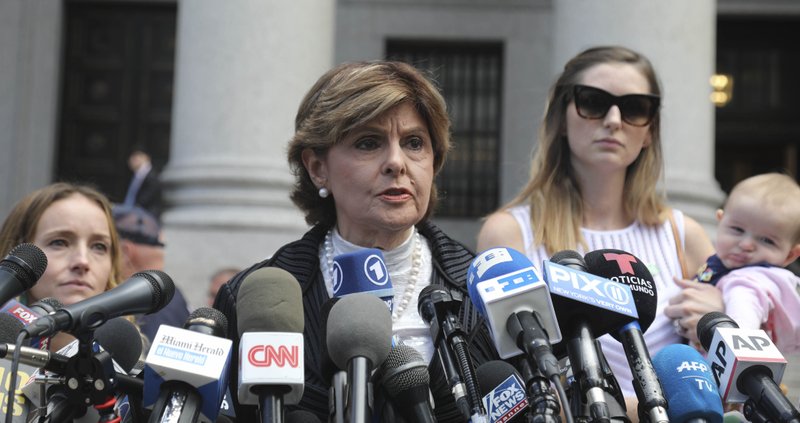 Attorney Gloria Allred, center, flanked by two of her clients, speaks during a news conference after leaving a Manhattan court where sexual victims, on invitation of a judge, addressed a hearing after the accused Jeffrey Epstein killed himself before facing sex trafficking charges, Tuesday Aug. 27, 2019, in New York. (AP Photo/Bebeto Matthews)