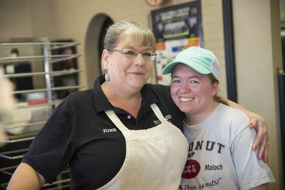 Owner June Maloch (left) on the final day of the Spudnut Shop. 