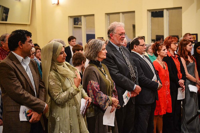 Interfaith Center executive director Sophia Said (second from left) and others take part in a past Love Thy Neithbor service. This year’s event will be held Thursday at Saint Mark’s Episcopal Church in Little Rock. 
