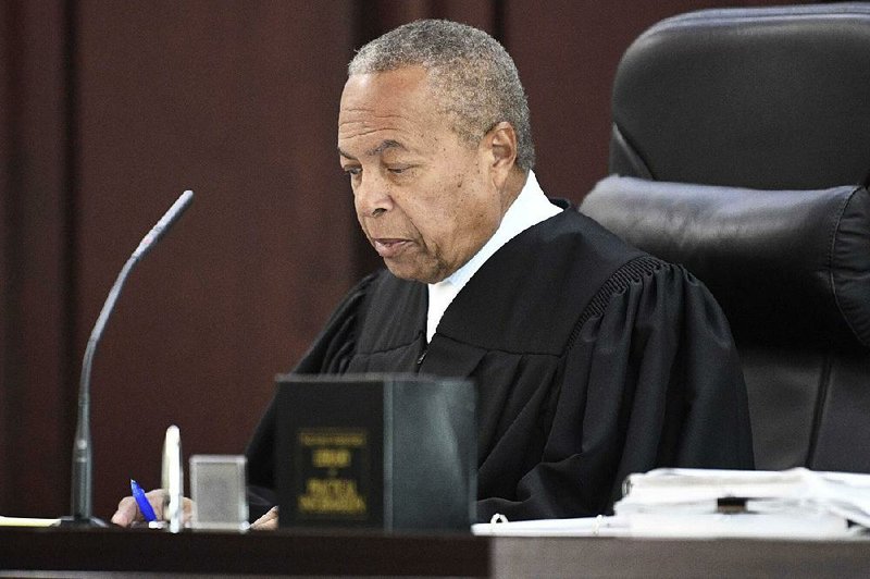 Criminal Court Judge Monte Watkins approves a deal Friday in  Nashville, Tenn.,  to vacate  the death sentence of Abu-Ali Abdur’Rahman, 68. 