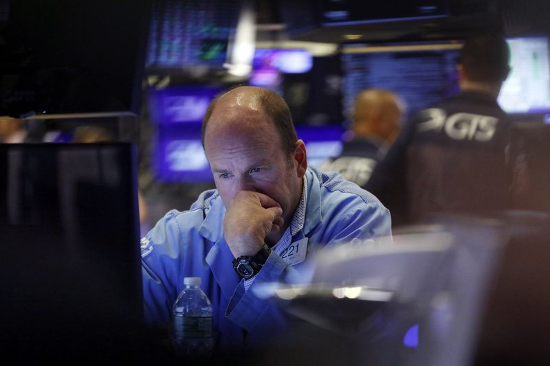 FILE - In this Aug. 23, 2019, file photo trader Peter Mancuso works on the floor of the New York Stock Exchange. The U.S. stock market opens at 9:30 a.m. EDT on Friday, Aug. 30. (AP Photo/Richard Drew, File)