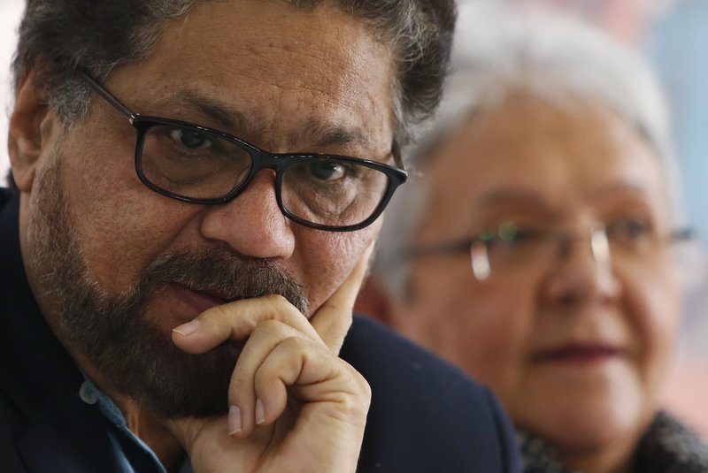  In this March, 8, 2018 file photo, Luciano Marin, also known as Ivan Marquez, a leader of the Revolutionary Armed Forces of Colombia, FARC, pauses during the announcement of the withdrawal of former guerrilla commander Rodrigo Londono from the race for president, citing both criticism of the political process and his serious health problems, at a press conference in Bogota, Colombia.  (AP Photo/Fernando Vergara, File)