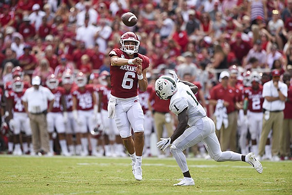 Arkansas quarterback Ben Hicks (6) throws a pass as Portland State's Romeo Gunt pressures him during a game Saturday, Aug. 31, 2019, in Fayetteville. 