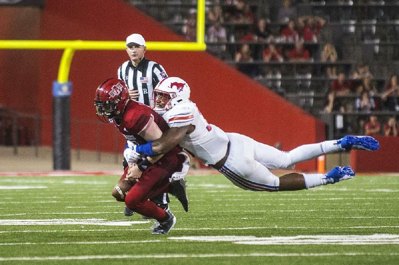 Arkansas State quarterback Logan Bonner was sacked by SMU’s Delontae Scott on the game’s final play Saturday as the Red Wolves fell to the Mustangs 37-30 at Centennial Bank Stadium in Jonesboro.