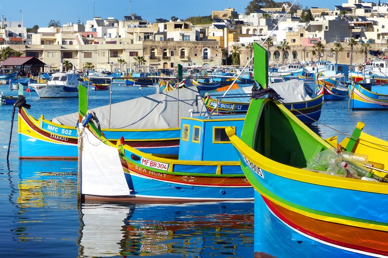 According to tradition, the colors of these Maltese fishing boats represent a fisherman's home village. (Photo by Gretchen Strauch via Rick Steves' Europe)