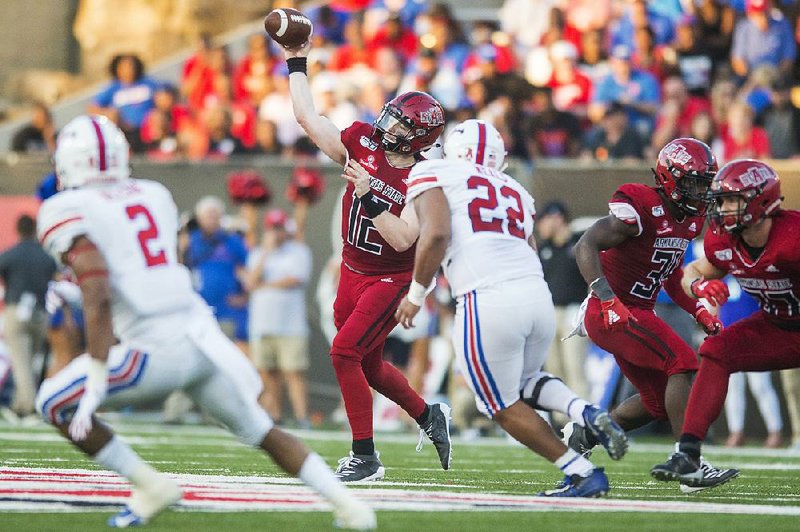 Arkansas State quarterback Logan Bonner (left) was 32-of-50 passing for 324 yards, 4 touchdowns and an interception in Saturday’s 37-30 loss to SMU at Centennial Bank Stadium in Jonesboro.