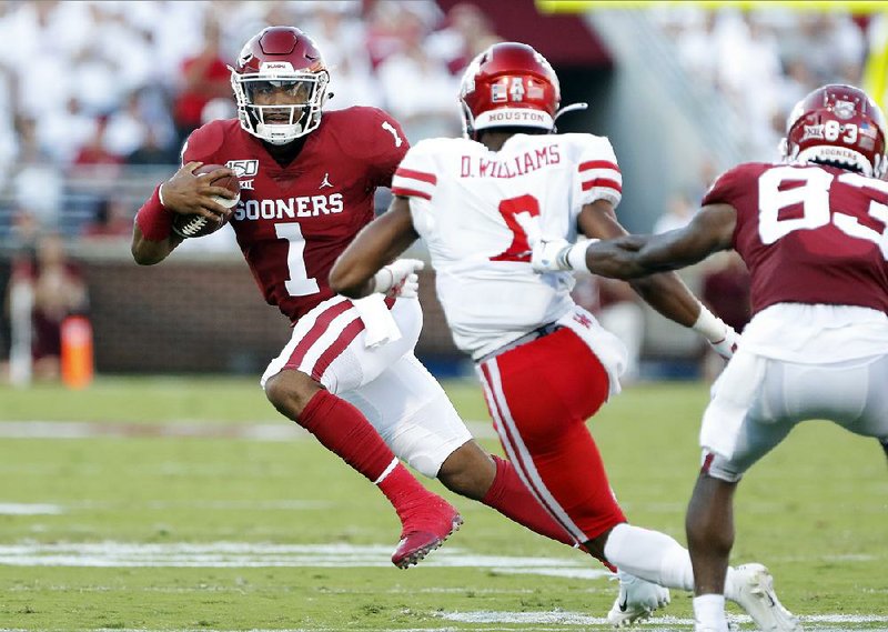 Oklahoma quarterback Jalen Hurts, in his debut with the team since transferring from Alabama, passed for three touchdowns and ran for three more, leading the Sooners past Houston 49-31 on Sunday in Norman, Okla.