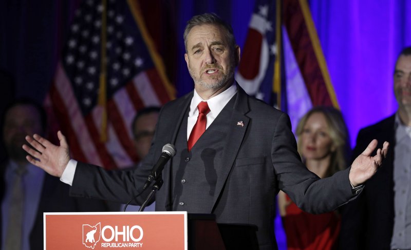 FILE - In this Nov. 6, 2018 file photo, Ohio Attorney General Dave Yost speaks at the Ohio Republican Party event in Columbus, Ohio. Yost is suing to stop upcoming trials seen as test cases for forcing drug makers to pay for societal damage inflicted by the opioid epidemic. Yost, a Republican, says attempts to force drugmakers to pay should come in a single state action to allow equal distribution of money across Ohio. Yost said allowing counties to go to trial individually could lead to inconsistent damage awards and some counties receiving nothing if they lose in court. (AP Photo/Tony Dejak, File)