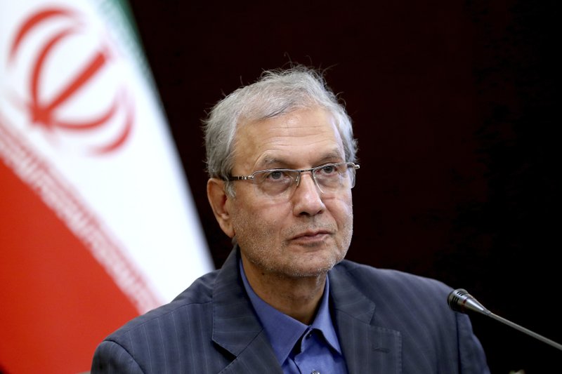 In this July 7, 2019, photo, Iran's government spokesman Ali Rabiei speaks in a press briefing in Tehran, Iran. Iran will "take a strong step" away from its 2015 nuclear deal with world powers if Europe cannot offer the country new terms by a deadline at the end of this week, Rabiei said Monday as top Iranian diplomats traveled to France and Russia for last-minute talks. (AP Photo/Ebrahim Noroozi)

