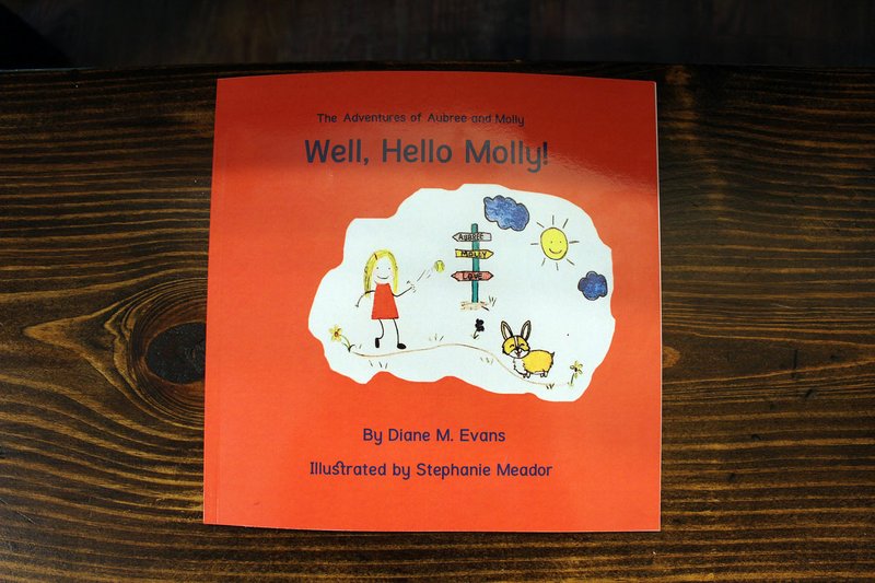 MEGAN DAVIS/MCDONALD COUNTY PRESS "Well, Hello Molly!" is authored by Diane Evans and illustrated by Stephanie Meador. The book is available online at Amazon.com. $1 from each book sale is donated to a local pet adoption agency.