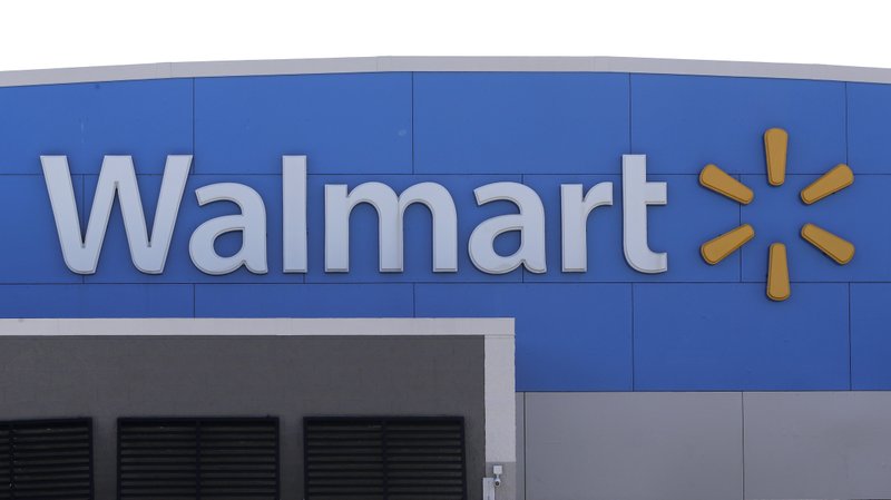 A Walmart logo is attached to the outside of a Walmart store, Tuesday, Sept. 3, 2019, in Walpole, Mass. (AP Photo/Steven Senne)