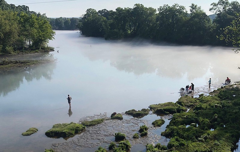 FILE — Trout fishermen try their luck on the shore of the Little Red River in Cleburne County in this July, 2019 photo. (Arkansas Democrat-Gazette file photo/Steve Goff)