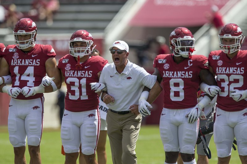 Chad Morris, Arkansas head coach, leads warmups before the game vs Portland State Saturday, Aug. 31, 2019, at Reynolds Razorback Stadium in Fayetteville.