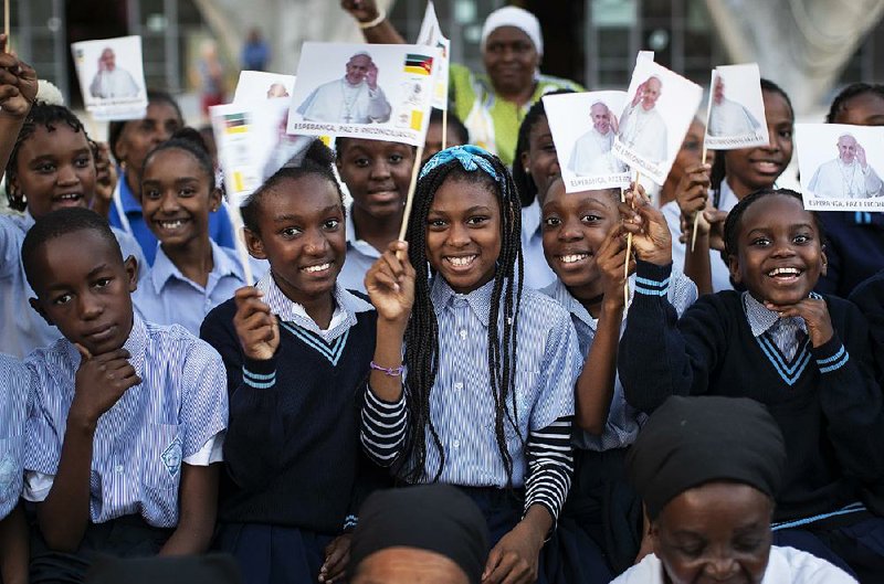 Schoolchildren wait Wednesday to see Pope Francis at the Apostolic Nunciature in Maputo, Mozambique. 