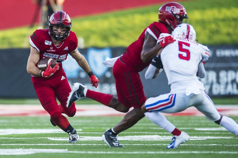 Junior Brandon Bowling (with ball) had a game-high 12 receptions for 92 yards Saturday against SMU in Arkansas State’s 37-30 loss to the Mustangs. 