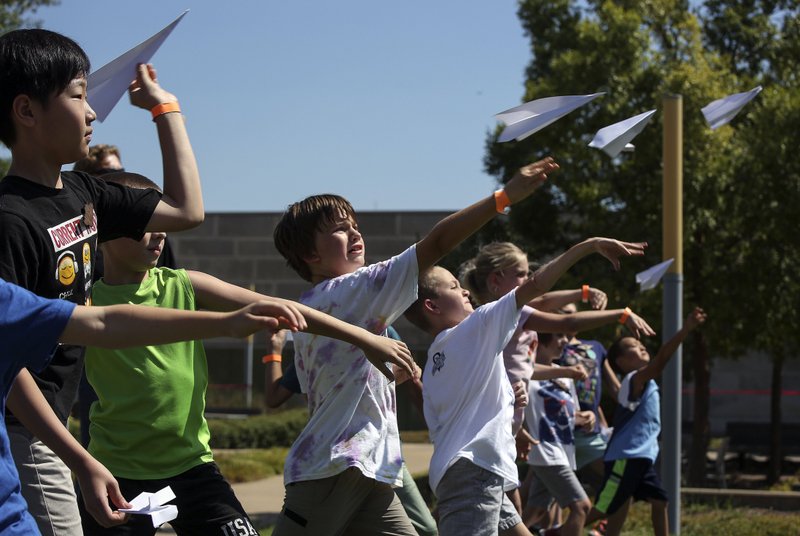 Contestants launch their planes at the 2018 Little Rock Paper Airplane Championship. The fundraiser for the Lymphomaniac Society is an "all in good fun" morning event for the whole family. Arkansas Democrat-Gazette/Mitchell Pe Masilun
 