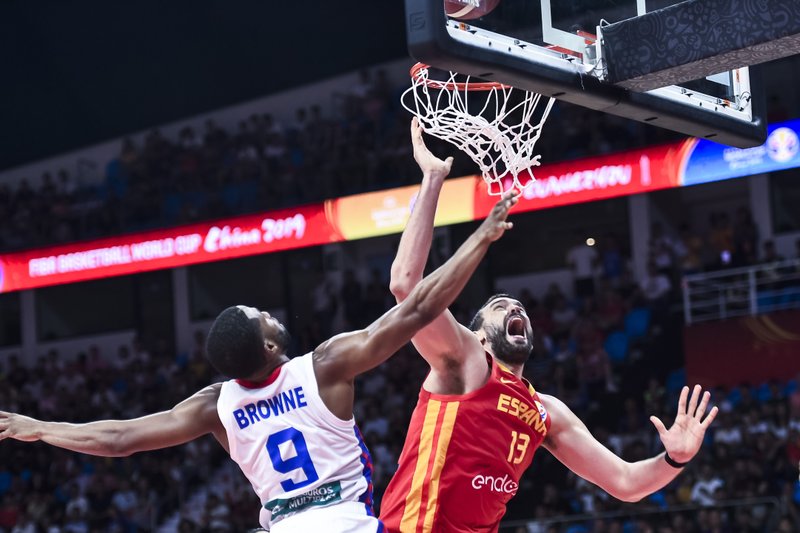 The Associated Press MOVING ON: Spain's Marc Gasol (13) competes with Puerto Rico's Gary Browne (9) Monday during a group C match for the FIBA Basketball World Cup 2019 in Guangzhou in southern China's Guangdong province. Puerto Rico will advance to the second round with its win over Tunisia Wednesday.