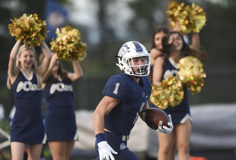 Bentonville West running back Luke Miller reacts Aug. 30 after a score against Owasso (Okla.) at Bentonville West High School in Centerton.