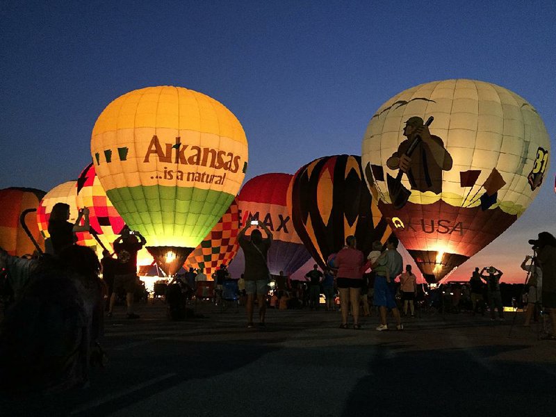 The 24th annual Arkansas Hot Air Balloon State Championship kicked off Friday night with a balloon glow at Boone County Regional Airport in Harrison. 
