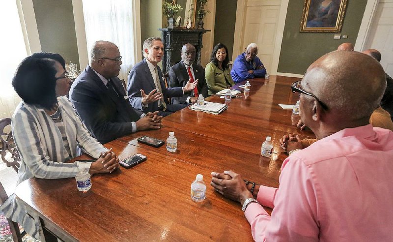 U.S. Rep. French Hill (center, left) talks Friday in Little Rock with officials of Shorter College, Philander Smith College, Arkansas Baptist  College and others about his measure aimed at aiding former inmates’ re-entry into society. 