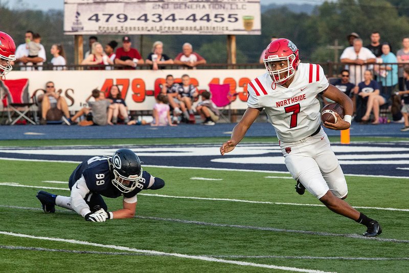 Quarterback Dreyden Norwood (right) and the Fort Smith Northside Grizzlies take on Van Buren tonight.