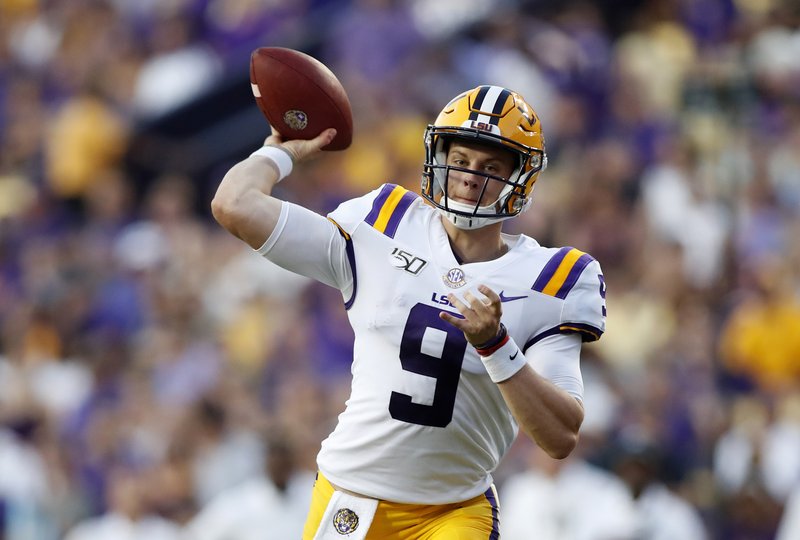 FILE - In this Aug. 31, 2019, file photo, LSU quarterback Joe Burrow (9) throws a pass during an NCAA football game against Georgia Southern in Baton Rouge, La. The LSU defense is dotted with players projected as future NFL first-round draft picks. And the Tigers unveiled a new up-tempo offense last week that saw Burrow tie a school record with five touchdown passes in the first half. (AP Photo/Tyler Kaufman, File)