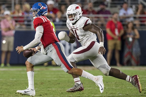 Arkansas defensive end Mataio Soli (11) chases Ole Miss quarterback Matt Corral during a game Saturday, Sept. 7, 2019, in Oxford, Miss. 