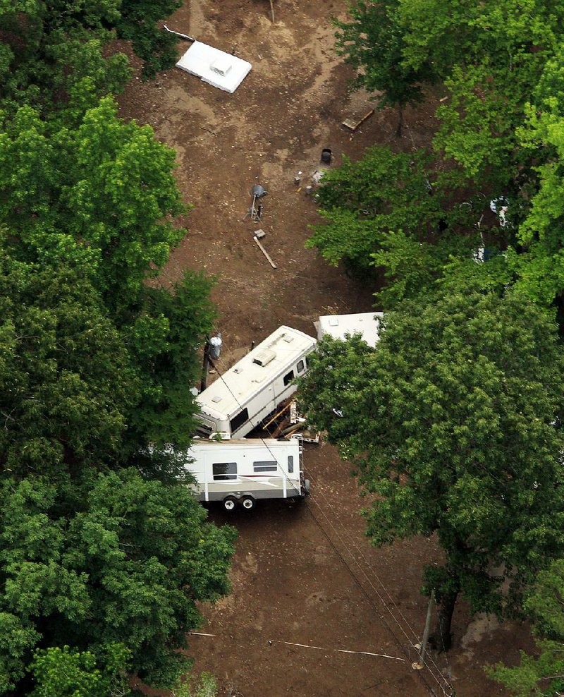 An aerial photograph taken June 11, 2010, shows recreational vehicles and camper trailers strewn through a campground at the Albert Pike Recreation Area in Montgomery County after the Little Missouri river flooded before dawn that day, catching campers without warning and killing 20 people. The once popular recreation area has been closed since then, but the U.S. Forest Service is studying the possibility of reopening it with safeguards.