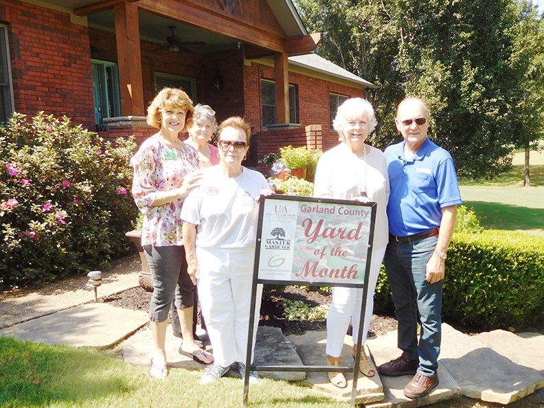 					Submitted photo

YARD OF THE MONTH: From left are Master Gardeners Juneann Greene, Anne Kendrick and Julie Dickson with homeowners Janna and Bob Pfautz. Not pictured are Master Gardeners Carolyn Davis and Jennetta Sanders, and Kristen Mangham, special events coordinator at Garvan Woodland Gardens.