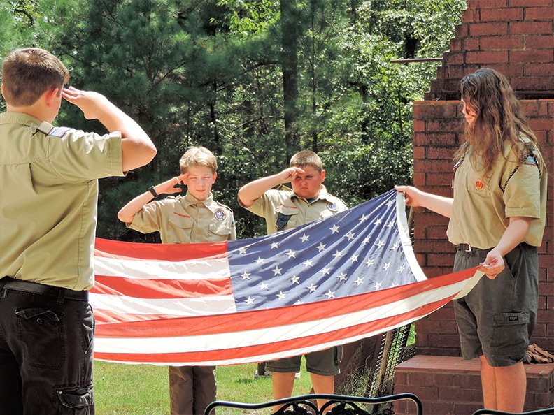 Submitted photo RETIRING OLD GLORY: Boy Scout Troop 10 holds a flag retirement ceremony.