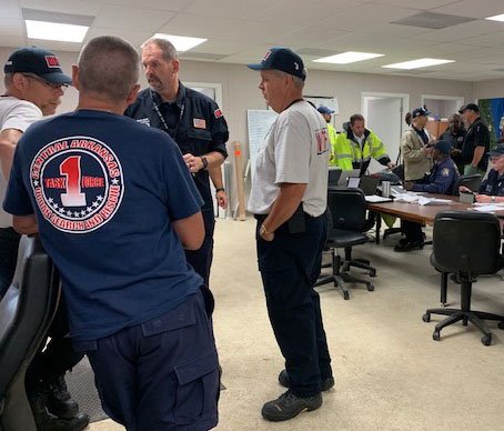Photo submitted Members of Arkansas Task Force 1, first responders from across the state, gather for a briefing Wednesday, Sept. 4, 2019, upon arriving to Jacksonville, Fla., to aid in Hurricane Dorian relief efforts.