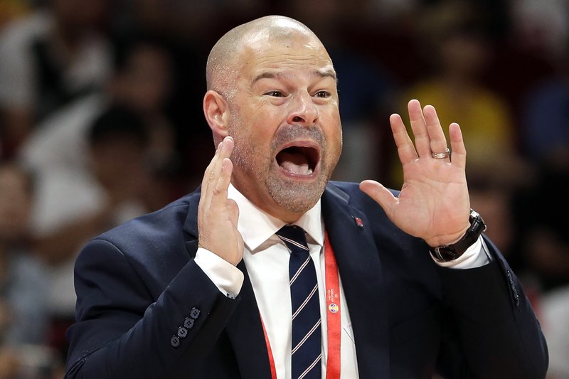 Poland's coach Mike Taylor calls out instructions to his team during their group phase basketball game against Ivory Coast in the FIBA Basketball World Cup at the Cadillac Arena in Beijing, Wednesday, Sept. 4, 2019. (AP Photo/Mark Schiefelbein)