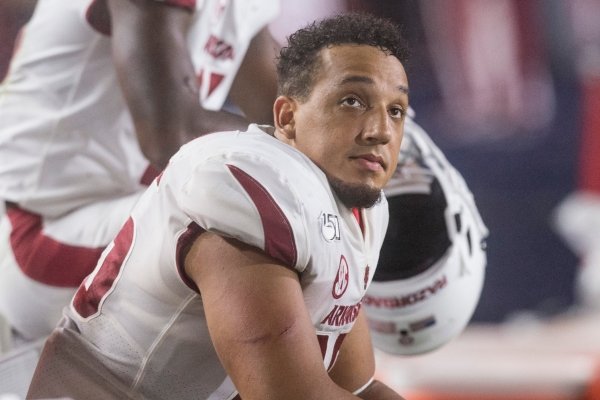 Cheyenne O'Grady, Arkansas tight end, watches from the bench in the fourth quarter vs Ole Miss Saturday, Sept. 7, 2019, at Vaught-Hemingway Stadium in Oxford, Miss.