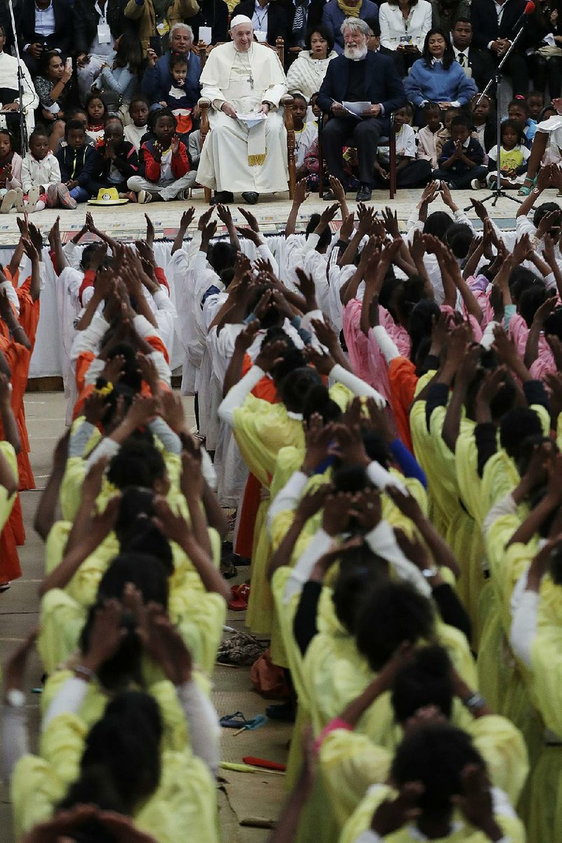 Pope Francis is welcomed during his visit Sunday to the “City of Friendship” community in Akamasoa, Madagascar. 