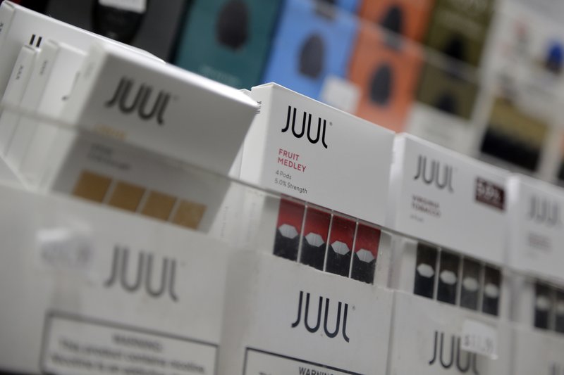 FILE - In this Dec. 20, 2018, file photo Juul products are displayed at a smoke shop in New York.  (AP Photo/Seth Wenig, File)