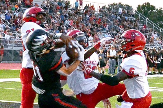 Pea Ridge's Hunter Rains, senior receiver, jumped for a touchdown against three defenders.