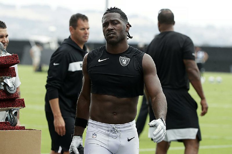 In this Aug. 20, 2019, file photo, Oakland Raiders' Antonio Brown walks off the field after NFL football practice in Alameda, Calif. story.lead_photo.caption