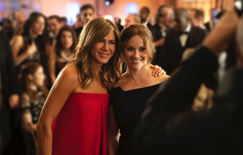 Jennifer Aniston (left) and Reese Witherspoon appear in a scene from "The Morning Show," a behind-the-scenes look at fictional players in the competitive morning broadcast realm. (Apple TV Plus/AP)