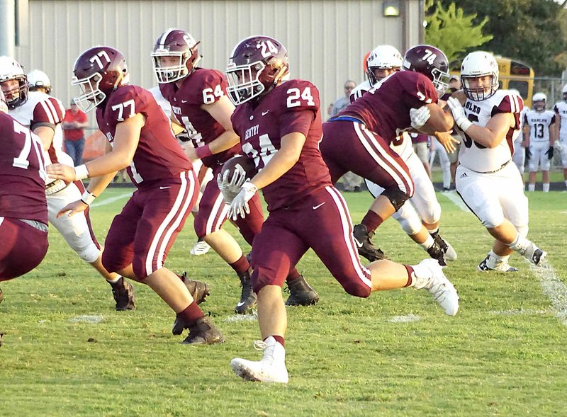 Westside Eagle Observer/RANDY MOLL Behind the blocking of his teammates, Gentry junior Brennan Crosby carries the ball down the field for the Pioneers during play against the Huntsville Eagles on Friday, Sept. 6, 2019, in Pioneer Stadium.
