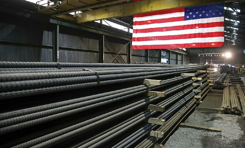 Steel rods produced at the Gerdau Ameristeel mill in St. Paul, Minn., sit ready for shipment in May. Japan hopes it can reach an agreement to be exempt from the Trump administration’s steel and  aluminum tariffs and from the threat of auto tariffs. In exchange, Tokyo would grant America’s farmers greater access to the Japanese market. 