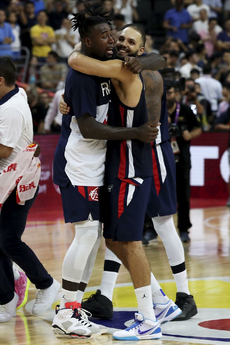 Mathias Lessort (left) and Evan Fournier celebrate after France defeated the United States 89-79 in the quarterfinals of the FIBA Basketball World Cup on Wednesday in China. 