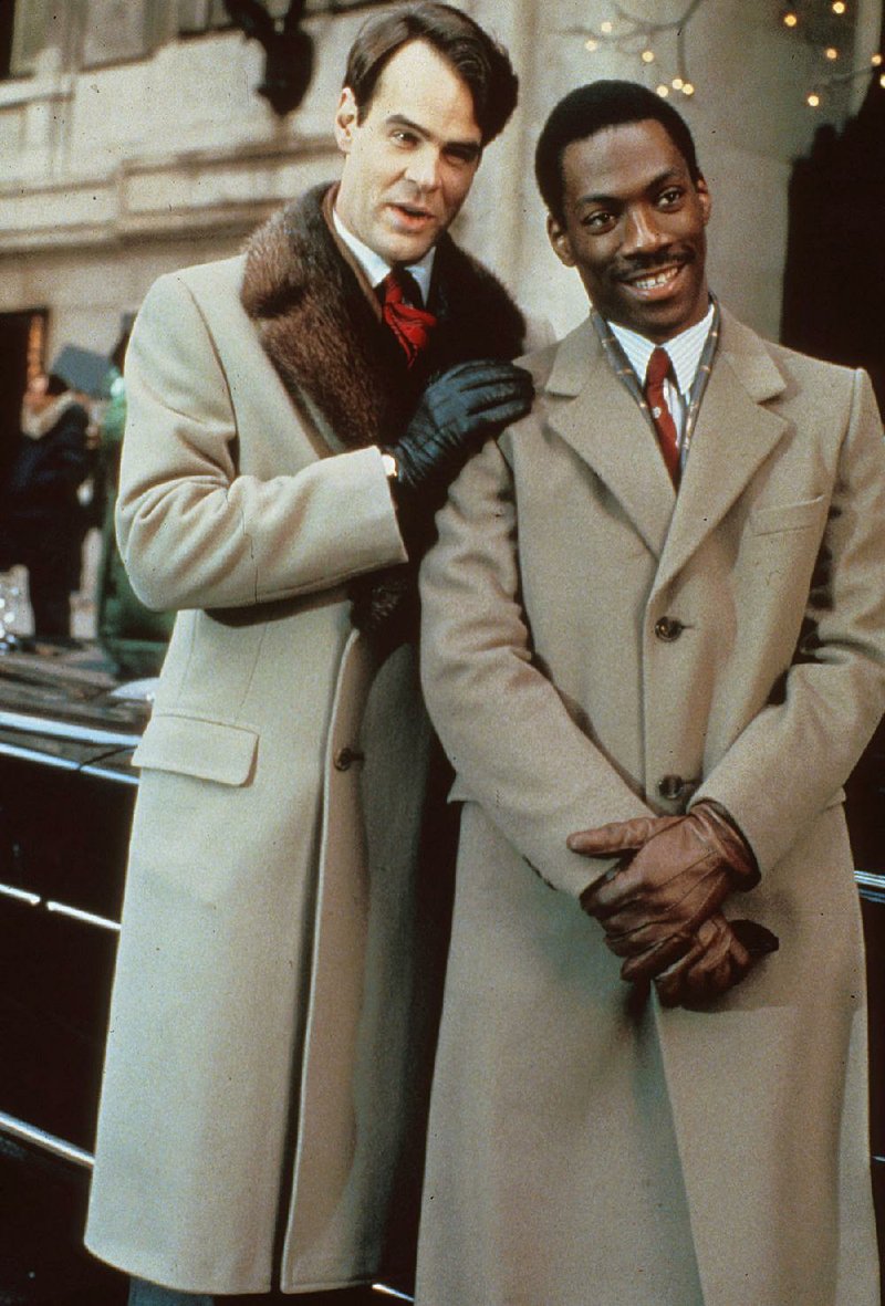 Eddie Murphy (right) and Dan Aykroyd, both Saturday Night Live alumni, starred in the 1983 film Trading Places. Murphy, who first appeared on SNL in 1980, is credited with helping save the failing series in the ’80s.