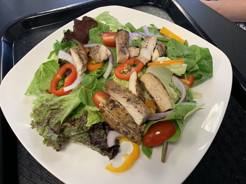 The jerk chicken on the Jerk Chicken Salad at Yeh Mon Jamaican Restaurant on west Little Rock's North Bowman Road was prepared to order, so it tasted just as fresh as the greens, bell peppers and cherry tomatoes underneath. Arkansas Democrat-Gazette/Eric E. Harrison
