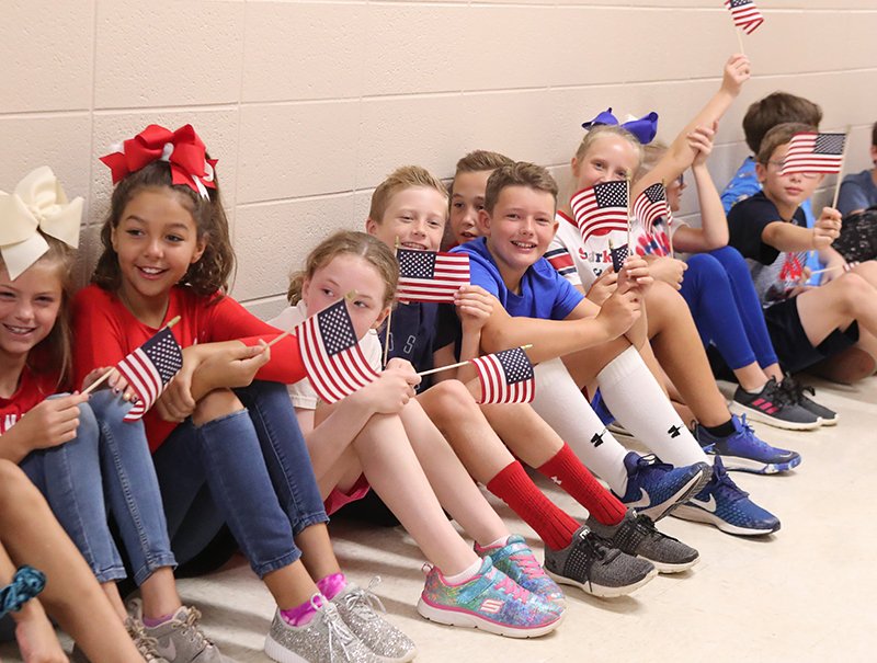 A group of Lakeside Middle School students wait for a choir performance during a Patriot Day event at the school Wednesday.  - Photo by Richard Rasmussen of The Sentinel-Record