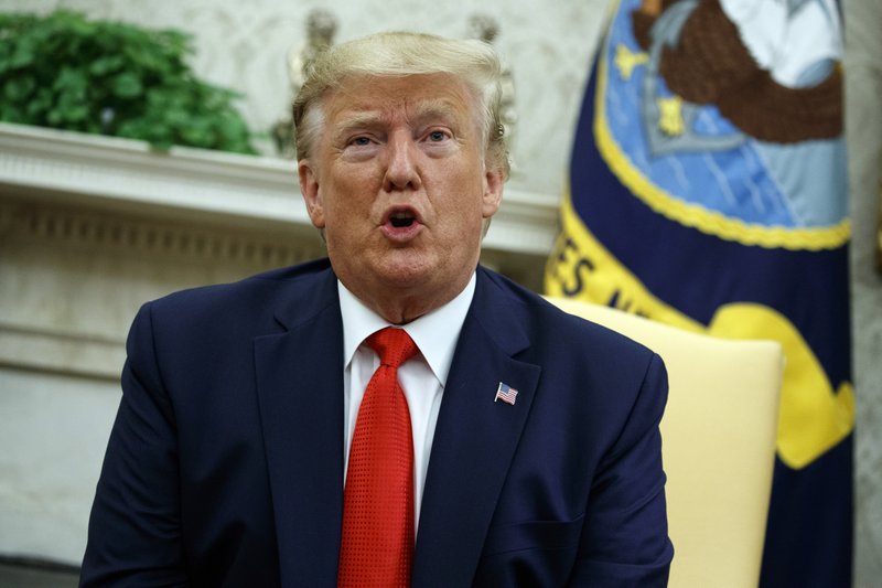 President Donald Trump talks about a plan to ban most flavored e-cigarettes, in the Oval Office of the White House, Wednesday, Sept. 11, 2019, in Washington. (AP Photo/Evan Vucci)