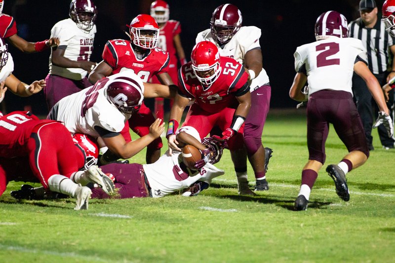 Magnolia junior lineman Jakameron Zachery (52) make sure Crossett’s Jaylon Lawson is down. The Panthers rallied in the fourth quarter to beat the Eagles 36-30 last week.